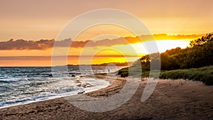 Colourful coastline sunset with beautiful beach and ocean