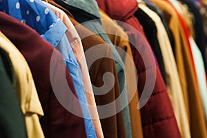 Colourful coats in the charity shop.