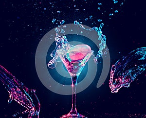 Colourful cocktail in glass with splash