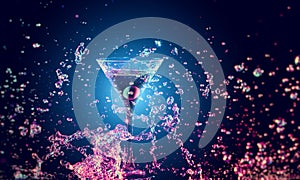 Colourful cocktail in glass with splash