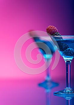 Colourful cocktails garnished with berries