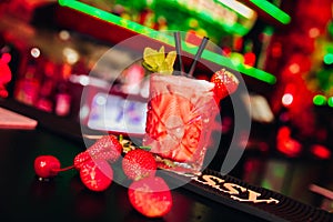 Colourful cocktails in light with beautiful bokeh served in nightclub