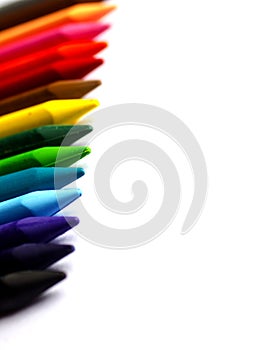 Colourful crayons on white background