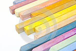 Colourful crayons on white background
