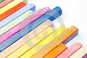Colourful crayons on white background