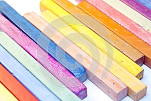 Colourful crayons on white background