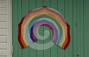 Colourful crocheted rainbow, a symbol of gratitude to the National Health Service NHS during the Coronavirus pandemic in the UK.