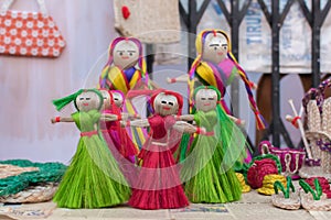 Colourful decorative wall hangings, dolls made of jute, handicrafts for sale Selective Focus