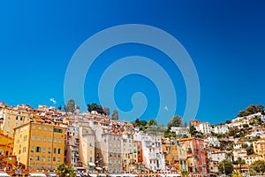 Colourful dense houses in Menton on azure coast in French riviera