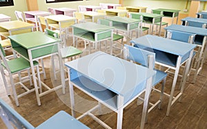 Colourful desk in class room on afternoon