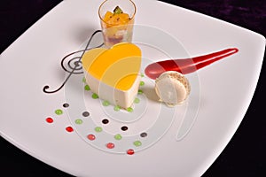 Colourful dessert at restaurant, mix fruits cake and macaron