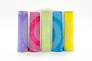 Colourful detailed messy chalk sticks on white background