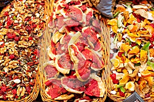 Colourful display of various candied fruits, and mixed nuts for sale at La Boqueria market in Barcelona