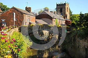 Colourful English floral village of Croston on the river Yarrow