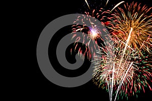 Colourful fireworks for celebration on dark background