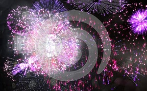 Colourful fireworks exploding on black background