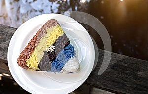 Colourful rice triangle shape in white ceremic dish photo