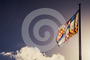 Colourful Flag against a blue sky