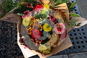 Colourful Flower Arrangement wrapped in brown paper