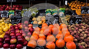 Colourful fresh fruit and vegetables on display in street market