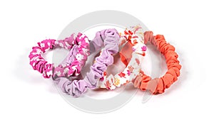 colourful hair scrunchies on white background