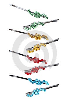 Colourful hairpins on a white background