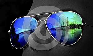 Colourful harbour look in sunglasses