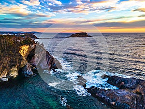 Colourful High Cloud Sunrise Seascape and Rock Formations