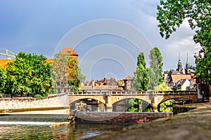 Colourful historic old town with half-timbered houses of Nuremberg. Bridges over Pegnitz river. Nurnberg, eastern