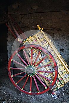 Colourful Horse carriage with red wheels