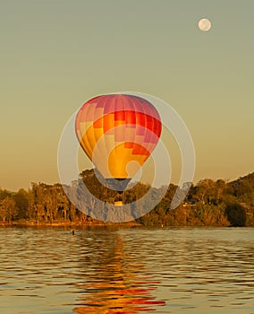 Colourful hot air balloon early morning flight