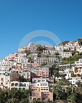 Colourful houses hugging the mountain side in the delightful town of Positano on the Amalfi Coast in Southern Italy.