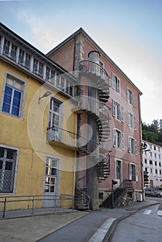 Colourful houses with spiral staircases outside