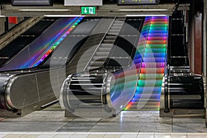 Colourful illuminated escalator steps in metro station, Stockholm, Sweden