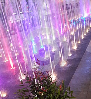 Colourful illuminated light fountain at night