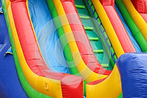 A colourful inflatable slide at a carnival