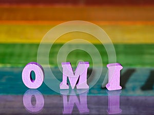 Inscription omi on background of lgbt flag photo