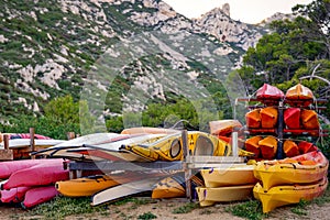 Colourful kayaks stocked on a beach in Marseille