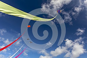 5 colourful kites in a blue summer`s sky