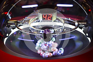 Colourful lottery balls in a lotto machine 42