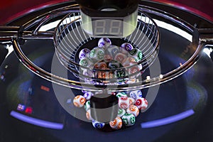 Colourful lottery balls in a lotto machine