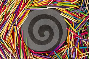 Colourful matchsticks with circle in the middle empty for your text