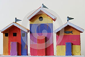 Colourful miniature wooden beach huts