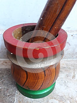 Colourful mortar pestle made up of wood.