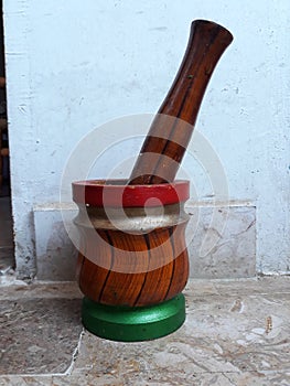 Colourful mortar pestle made up of wood.