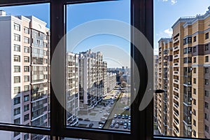 Colourful multi-storey complex of new buildings from balcony, Top view of beautiful multicolored design of facade of