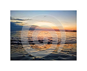 Colourful ocean water and sunset