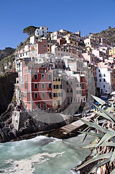 Colourful old houses and dock of fisherman village Riomaggiore, Cinque Terre, Liguria, Italy