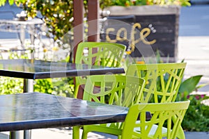 Colourful outdoor seating tables and chairs in cafe