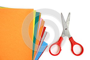 Colourful paper with office and school stationary on white